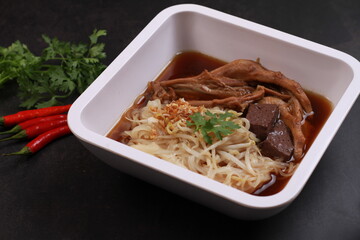 Duck noodle soup isolated gray background, one of famous soup in Thailand