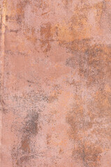 Old texture of rusty sheet metal with peeling brown paint.