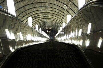 The escalator in the metro. lights on the escalator of the city subway
