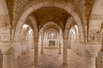 Fototapeta na wymiar Romanic church of Sant'Ubaldo in Apiro,Italy, view of the crypt with columns and cross vaults