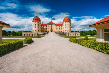 Germany, Saxony region, Dresden, Castle Moritzburg. Beautiful spring day with blue sky and white...