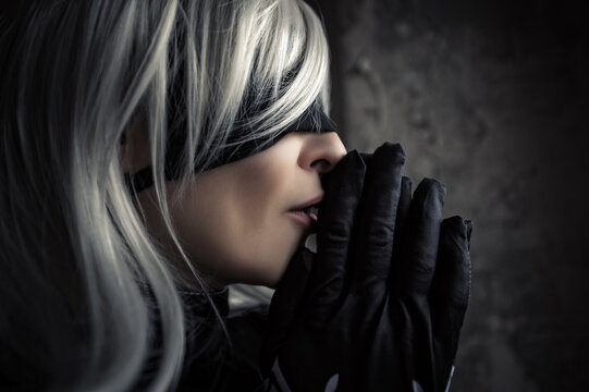 profile face woman in white wig and black blindfold, cosplay