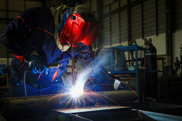 Specialist welder weld construction frame, welding spark