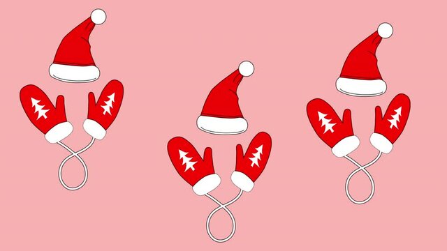 Funny background. Christmas and New Year celebration concept. Red Santa hat and gloves dancing on pink background. Copy space