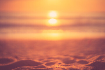 Tropical beach with smooth wave and sunset sky abstract background.