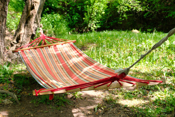 Hanging hammock for relax and sleep in the green forest of Eastern Serbia