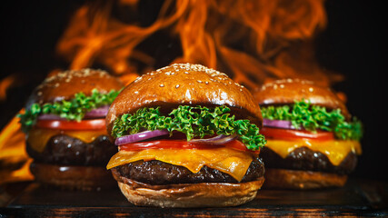 Tasty cheeseburgers, lying on vintage wooden cutting board, fire flames in background.