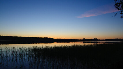Fototapeta na wymiar Sunset on lake near Saint-Petersburg, Rusia