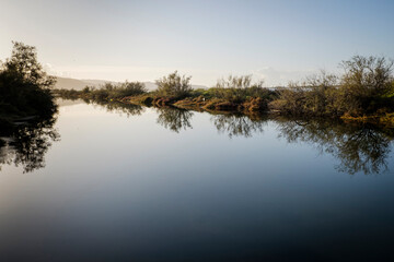 A very calm and flat body of water