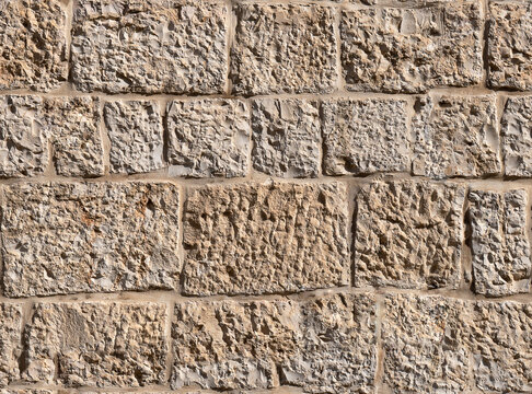 Ancient stone wall in old Jerusalem seamless texture background.