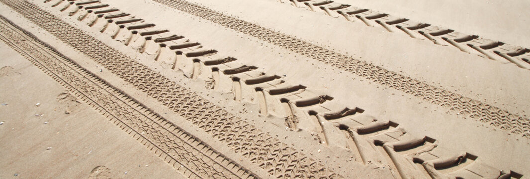 Tyre print on a sand beach