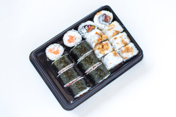 Sushi maki and crispy rolls on the plate
