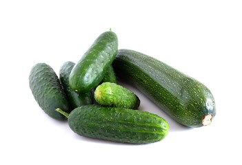 Cucumbers and zucchini on a white background. Suitable for mockups and backgrounds. Food preparation. Vegetables.