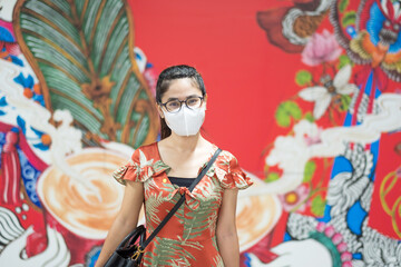 young Asian girl wearing Protective face mask protect coronavirus inflection, Happy tourist woman...