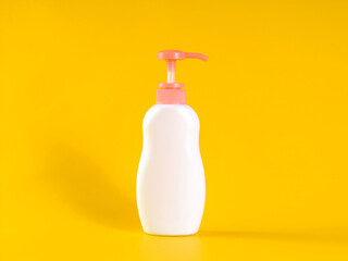 Blank label bottle of antibacterial liquid soap and hand sanitizer mockup on yellow background. White unbranded dispenser bottle isolated on yellow background. Hygiene product and health care.