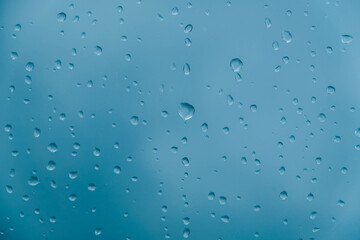 Water drops on a transparent polythene after a rain as a background image. Top view. Copy, empty space for text
