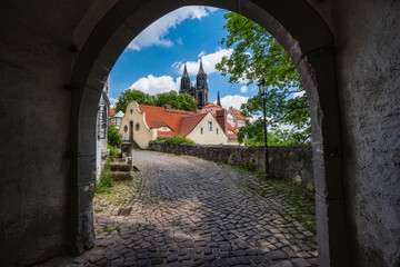 Arch gate to medieval Meissen old city with beautiful Albrechtsburg Castle in background. Dresden,...