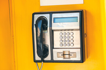 close up of the public pay phone in the city