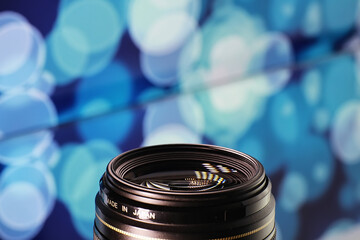 Equipment videographer and photographer. Lenses on the table against the background of bright...