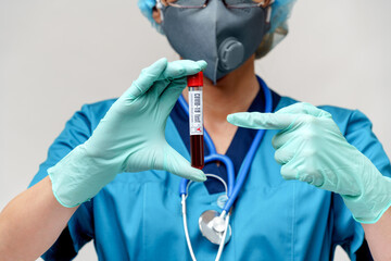 medical doctor nurse woman wearing protective mask and gloves - holding positive coronavirus...