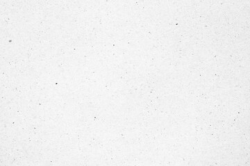 White paper or cardboard texture with black spot background.