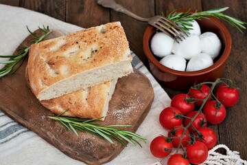 Sliced focaccia bread with tomatoes and mozzarella