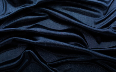Texture of blue fabric in waves.