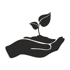Plant in hand black icon