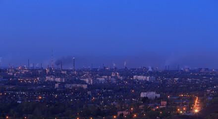 Evening city in eastern europe, industrial area in the background