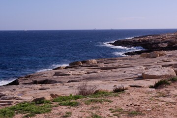 Empty rocky sea shore. Marsasсala, island of Malta