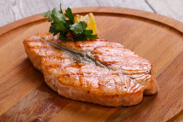 Grilled salmon served lemon and parsley