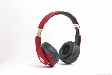 Red headphone isolate on white background.
