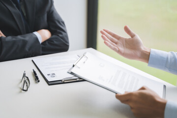 Employment concept, Employer recruiter with candidate with resume in job interview.