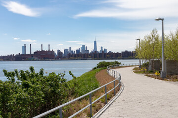 Empty Riverfront at Hunters Point South Park in Long Island City Queens with a view of the Manhattan Skyline along the East River in New York City