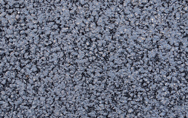Texture of fresh and new black asphalt. Background of new asphalt.