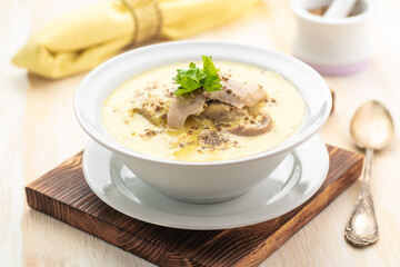 Thick creamy chicken soup. Soup with an egg.