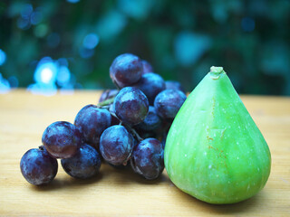 Ripe red Grapes and Fig, food for the proper functioning of the heart muscle