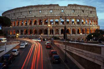Fototapeta na wymiar Illuminated Coliseum at dusk, Rome, Italy