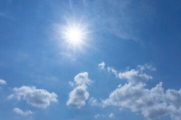 Blue sky white clouds with halo pentagram shiny sun on sunny day,copy space