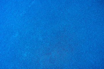 Solid color background. An empty, matte blue surface. Abstract blank for design.