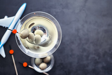 Travel concept. Tourist accessories gather in flight. Alcohol, camera, map and items.