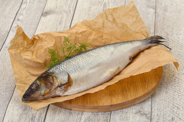 Salted herring over the wooden board