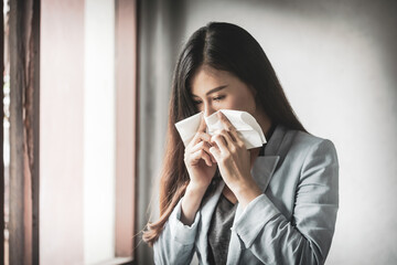 Women who have a cough and are ill with a flu infection - therefore have to use toilet paper to cover the mouth and nose.