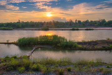 Riverside and sunset sky. Composition of nature.