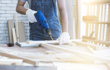 Close up to hand using drill