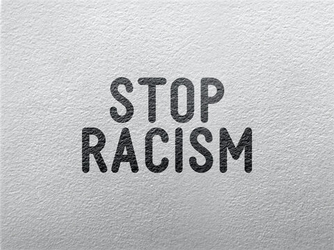 Stop racism - word on a grey textured background