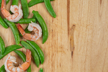 Fried prawns with fried peas and green peas.