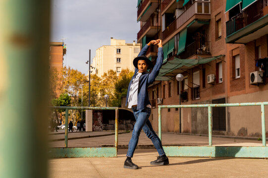 Young man moving and dancing outdoors