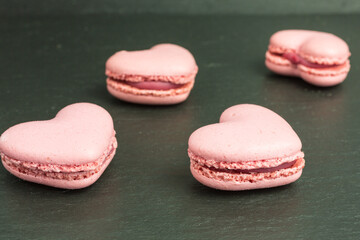 heart shaped macaroons in pink with cream
