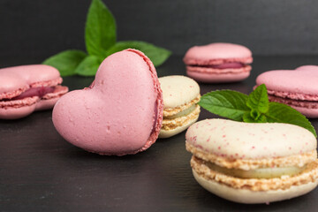 heart shaped macaroons  in pink and pale yellow with mint